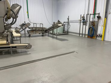 Urethane Cement with gray coating in a food facility.