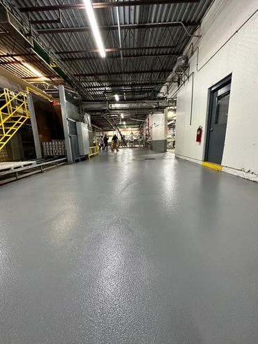 AMERICLAD epoxy mortar system with AMERICOAT gray epoxy coating in a food facility.