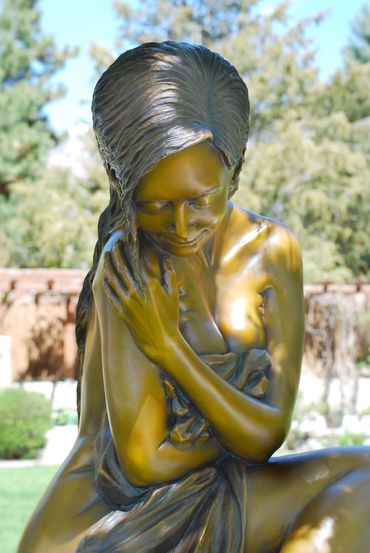 Figurative female life size bronze statue by figurative & equine bronze sculptor, J. Anne Butler.