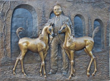 The entrance way bas relief bronze at the WK Kellogg Arabian Horse Library.