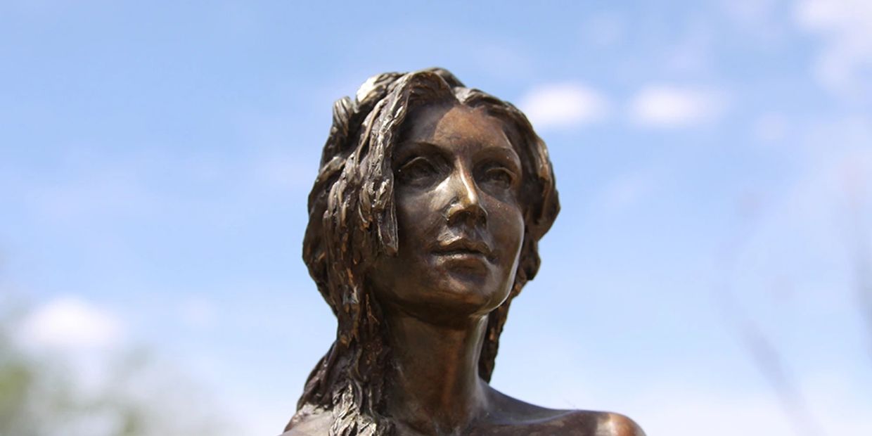 Earth figurative female form bronze sculpture