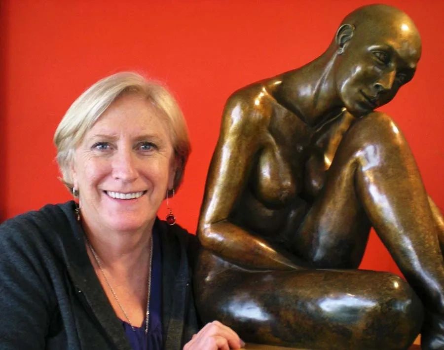 Sculptor with Purity nude bronze sculpture.