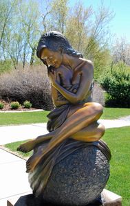 Life size figurative, female form bronze sculpture named Solitaire. 