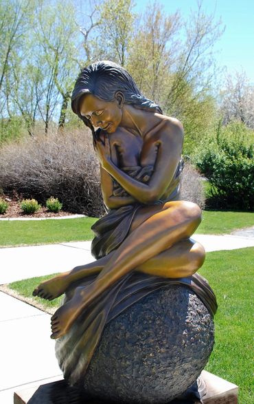 Figurative female life size bronze statue by figurative & equine bronze sculptor, J. Anne Butler.