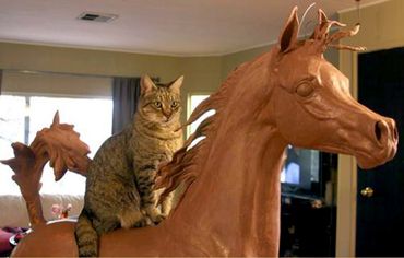 A life size horse sculpture in progress with a little help from studio cat, Oliver.