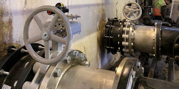 New Tomoe butterfly valve installed with stainless steel spacers at The NEC Birmingham.