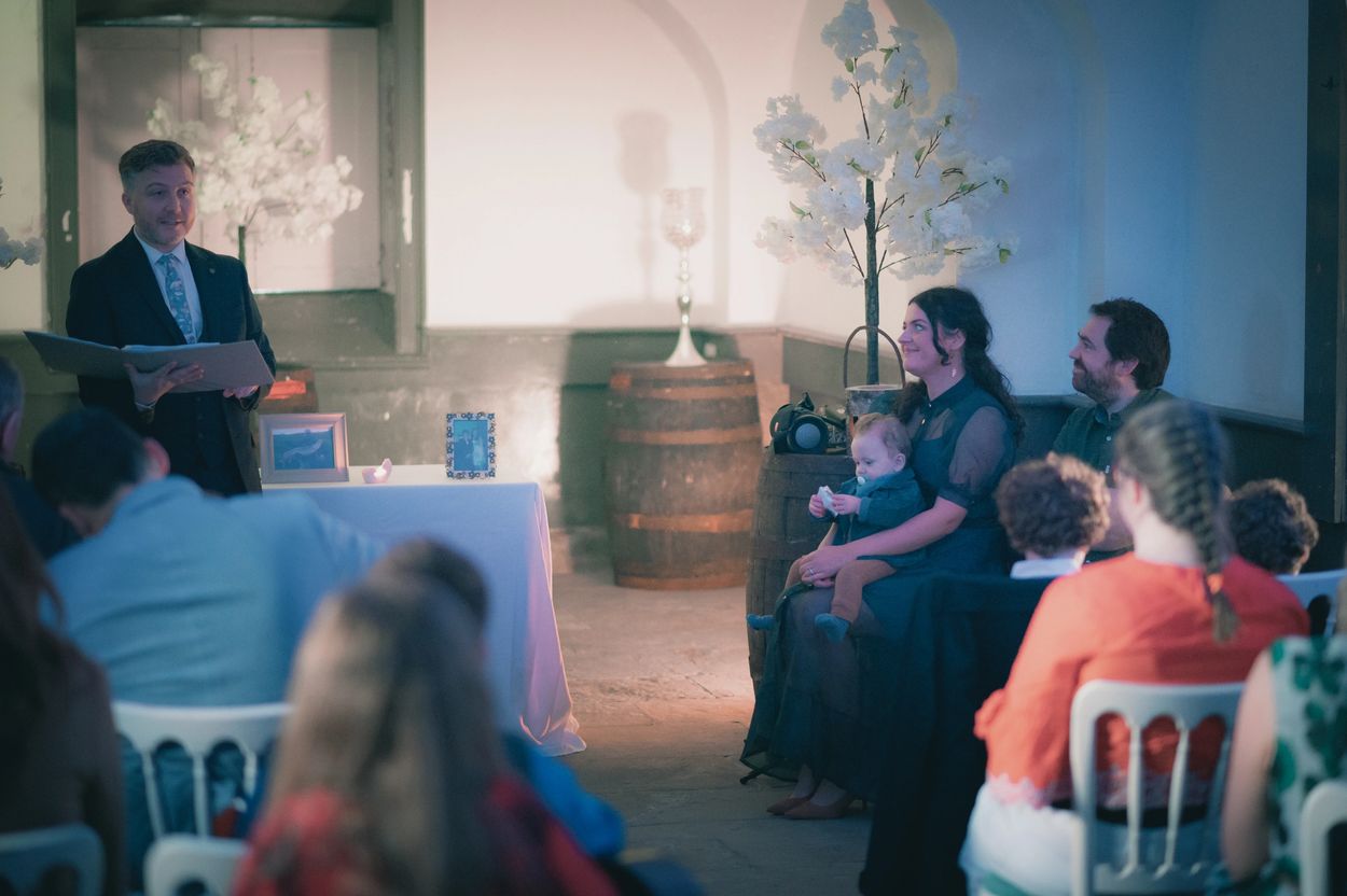 My friend and colleague, Michael Conlon, officiating at my little boy's naming ceremony