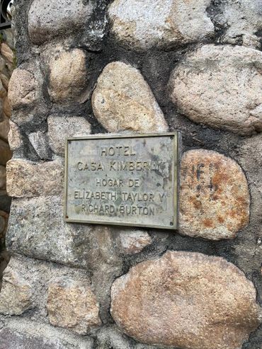 Plaque on a stone wall for Hotel Casa Kimberly, home of Elizabeth Taylor and Richard Burton.