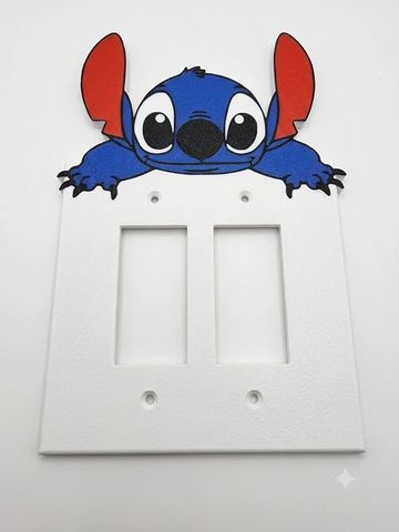 Cartoon character-themed light switch cover.