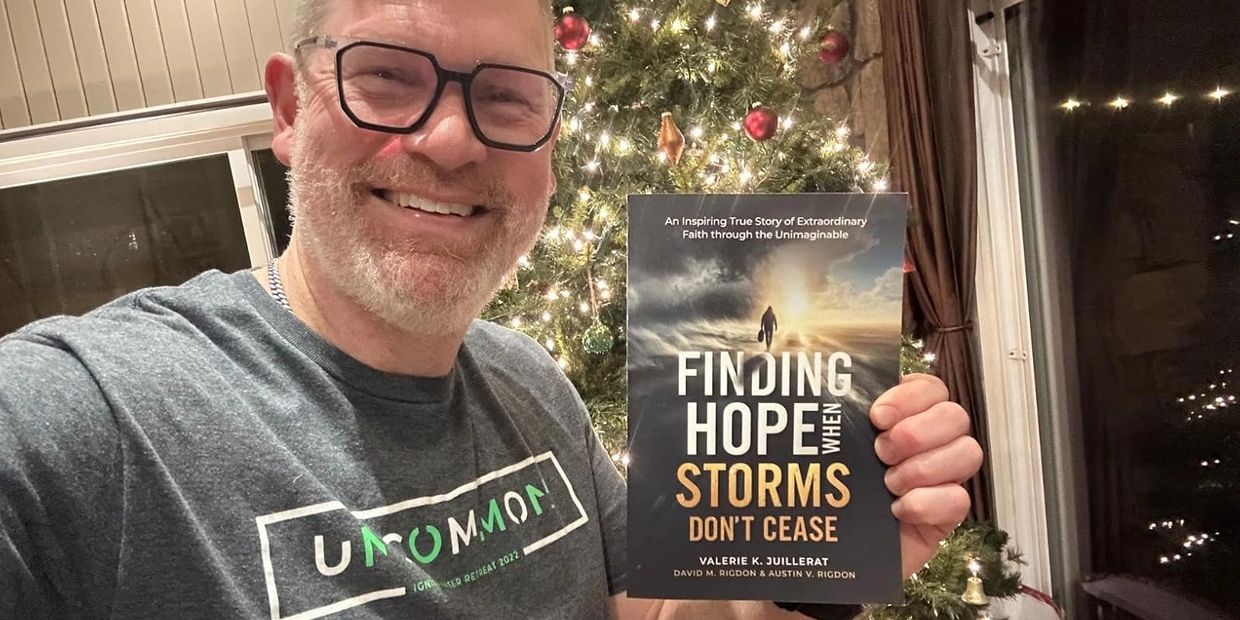 Film Producer, Lance Clark holding his copy of the book Finding Hope When Storms Don't Cease.