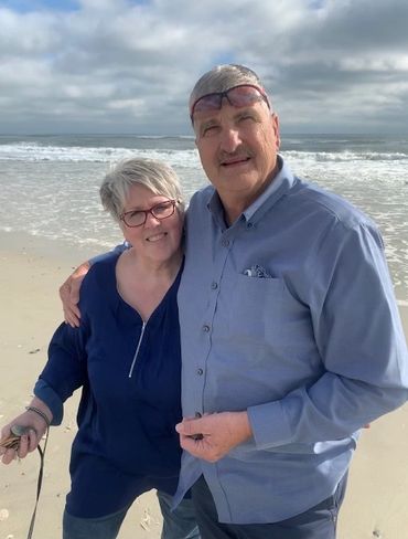 My husband, William, and me at the ocean near our new, forever home!