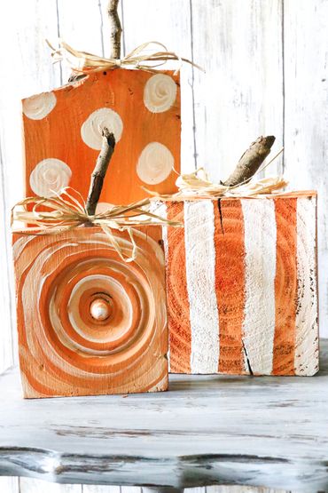 4 x 4 treated posts, converted to whimsical pumpkins with little stick stems and raffia. I had a pi