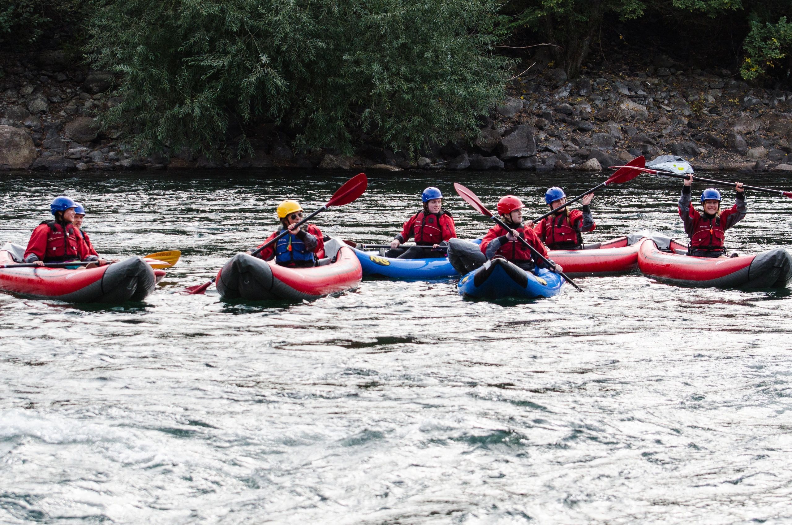 A Group of Kayakers in IKs learn some strokes