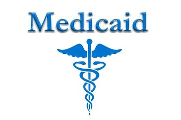 Medicaid logo with medical symbol.