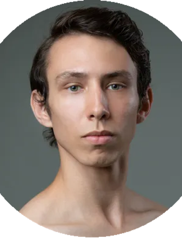 Portrait of a young man with short dark hair and neutral expression.