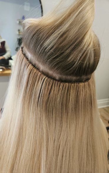 Under the hood beaded row with hand tied weft hair extensions.