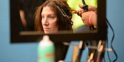 a womans face in the mirror