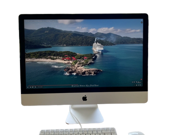 A computer screen displaying a cruise ship near a tropical island.