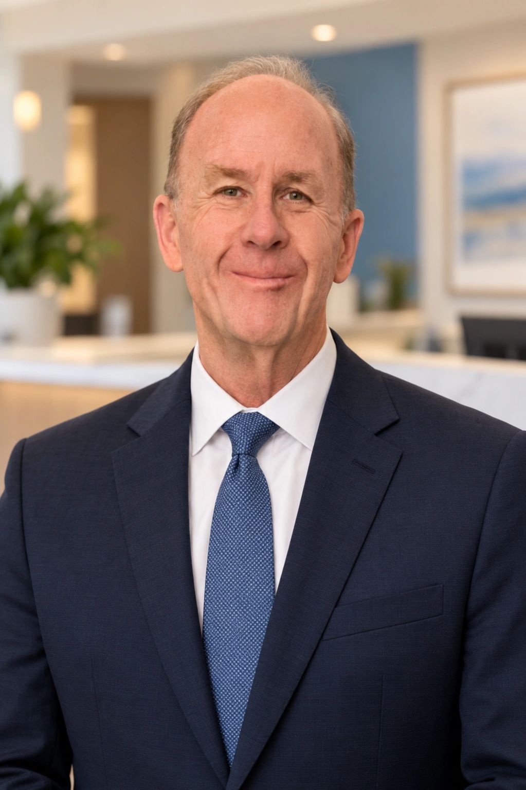 Michael Morrissey, Practice Driver founder, in a navy suit and blue tie.