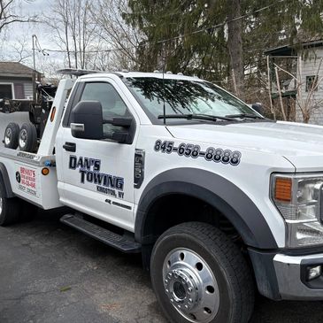 Danny's Towing white tow truck ready for service in Kingston, NY — towing and roadside help.