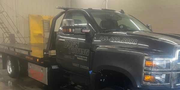 Danny's Towing flatbed truck in Kingston, NY. Trusted for classic and luxury vehicle transport.