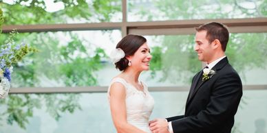 A photograph of a bride and a groom at a wedding.