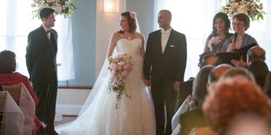 A photograph of a bride and a groom at a wedding.