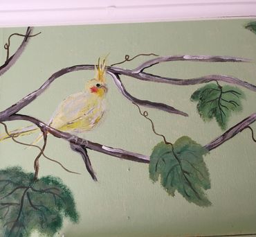 Painted bird on the tree branch