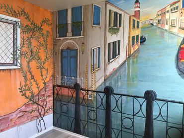 Mural by Dalia Garcia, canal in Venice, Italy, buildings, flower boxes, bridge