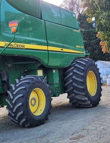 John Deere 9670 Combine with fall leaves in the background
