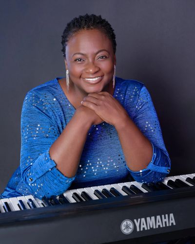 Canangela, piano and voice instructor, at the Keyboard or Piano.