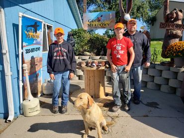 boys and dad with trained dog