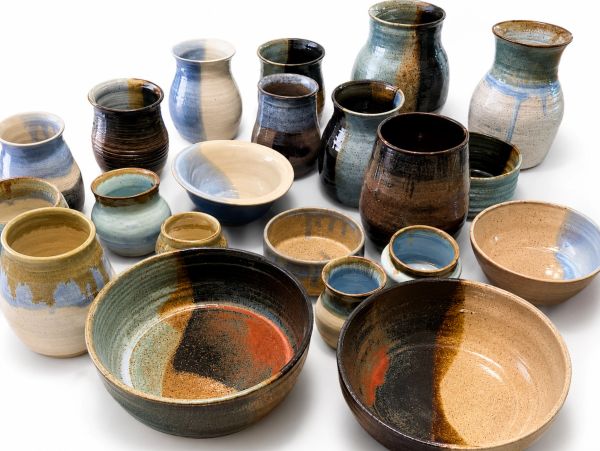 A collection of colorful ceramic bowls and vases.