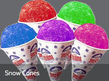 Colorful snow cones in white cones.