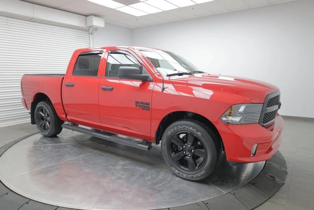 2023 Ram 1500 Classic Express 4WD red crew cab pickup truck for sale in Calgary, reliable full-size