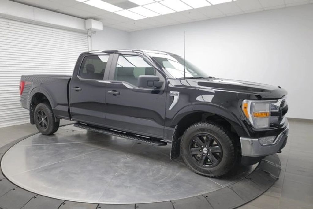 2022 Ram 1500 Classic Warlock 4WD black crew cab pickup truck for sale in Calgary, used truck