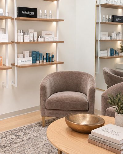 Cozy chair in a modern skincare clinic waiting area.