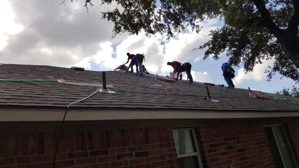 Reliant Roofing crew working hard