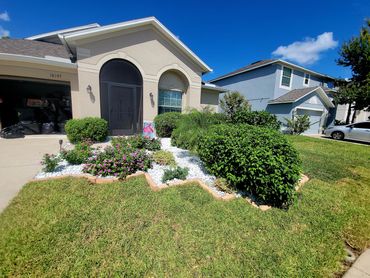 Removed mulch then added a paver perimeter and filled the area with 3" of marble chips.