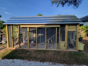 15'x5' A-frame chicken run with a loft coop, small chicken door, external nesting boxes and ramp.