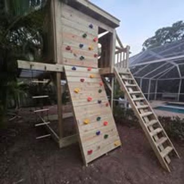 Playscape with clubhouse, rock wall, monkey bars, and more.