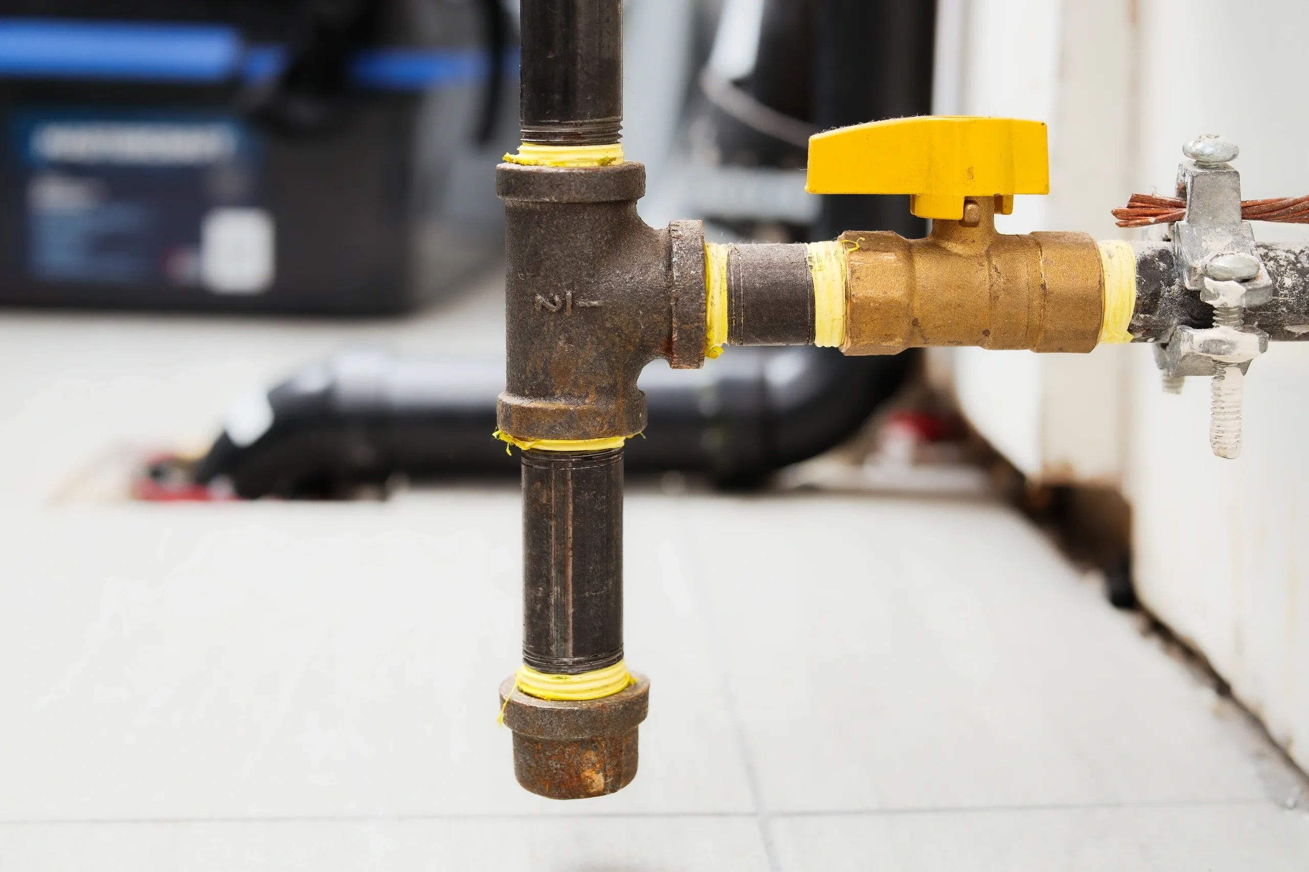 Gas pipe with yellow shutoff valve for residential gas line service in Morgan Hill, CA.