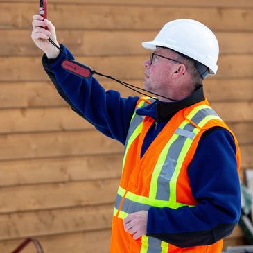 Pilot using wind meter in pre-flight routine.