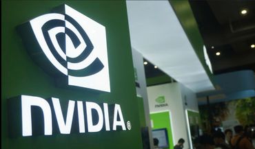 Illuminated Nvidia logo at a tech exhibition booth.