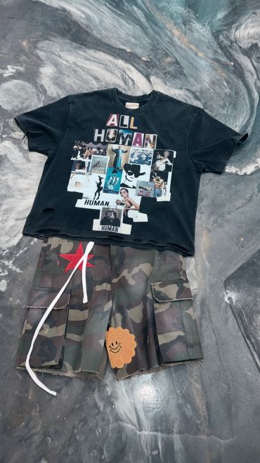 Casual outfit with graphic t-shirt and camo shorts.