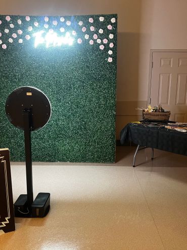 Misty C Visuals digital photo booth with ring light and touchscreen setup at an indoor event venue in Alberta.