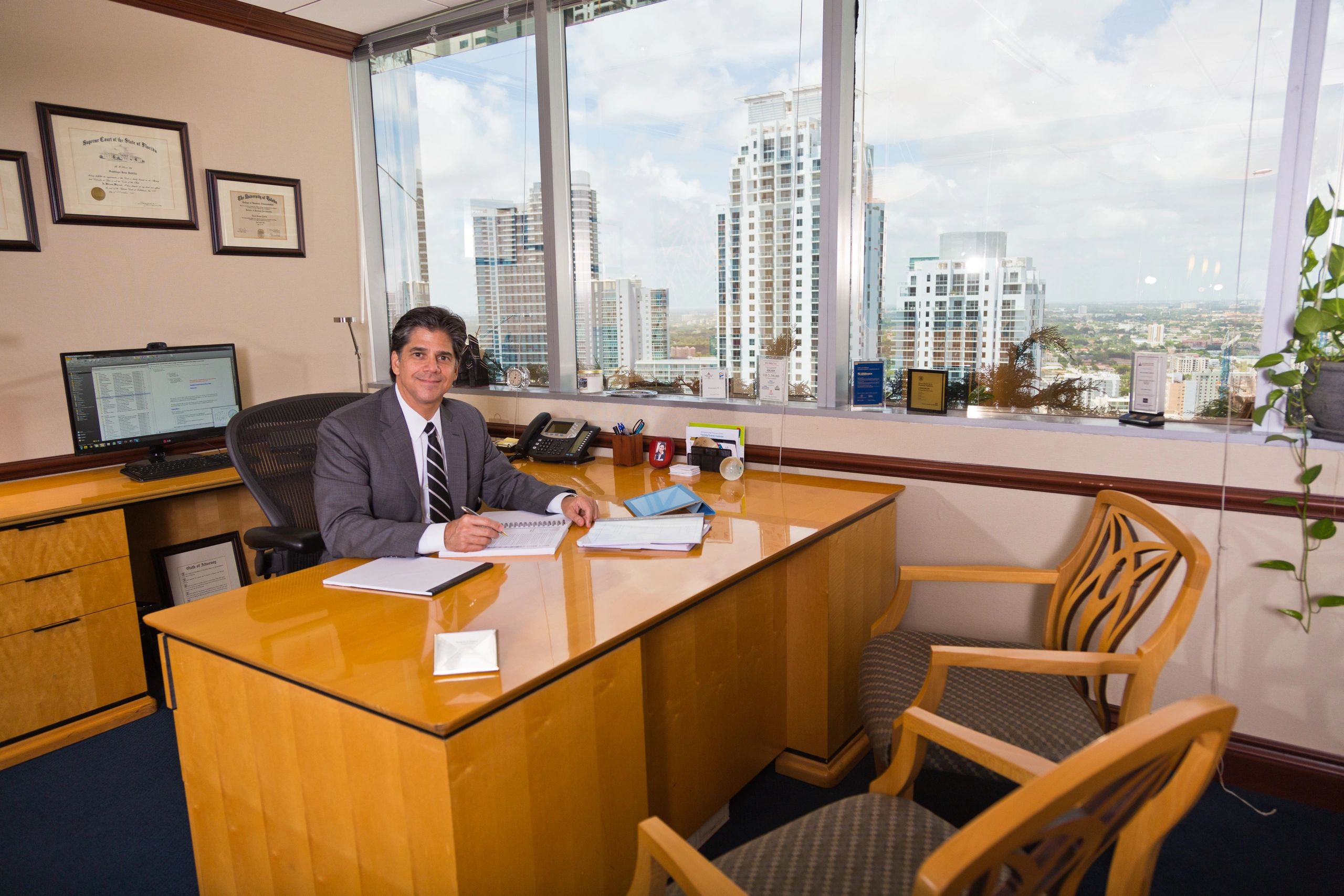 Santiago J. Padilla, Esq. sitting at his desk.