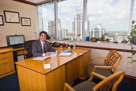 Santiago J. Padilla, Esq. sitting at his desk.