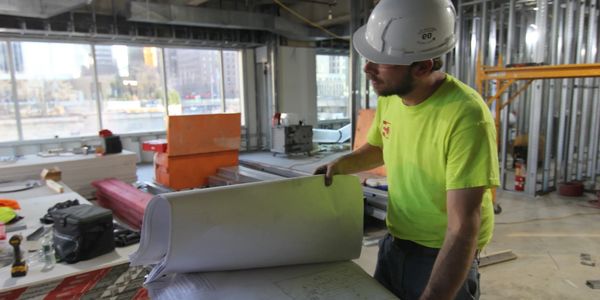 Foreman Joe Delfino reviews electrical drawings before starting the day at Deming Electric, LLC.