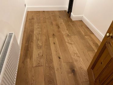 Engineered Oak Plank floor in a bedroom in Linton, Near Swadlincote in Derbyshire